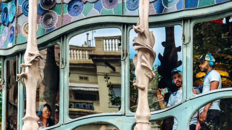 Travelers take a self-guided tour in a museum in Barcelona.