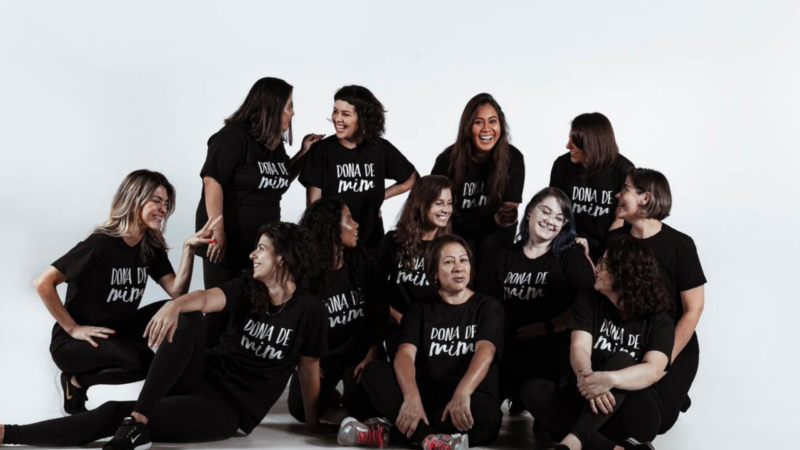 A team of female tour guides in Brazil smile for a group photo